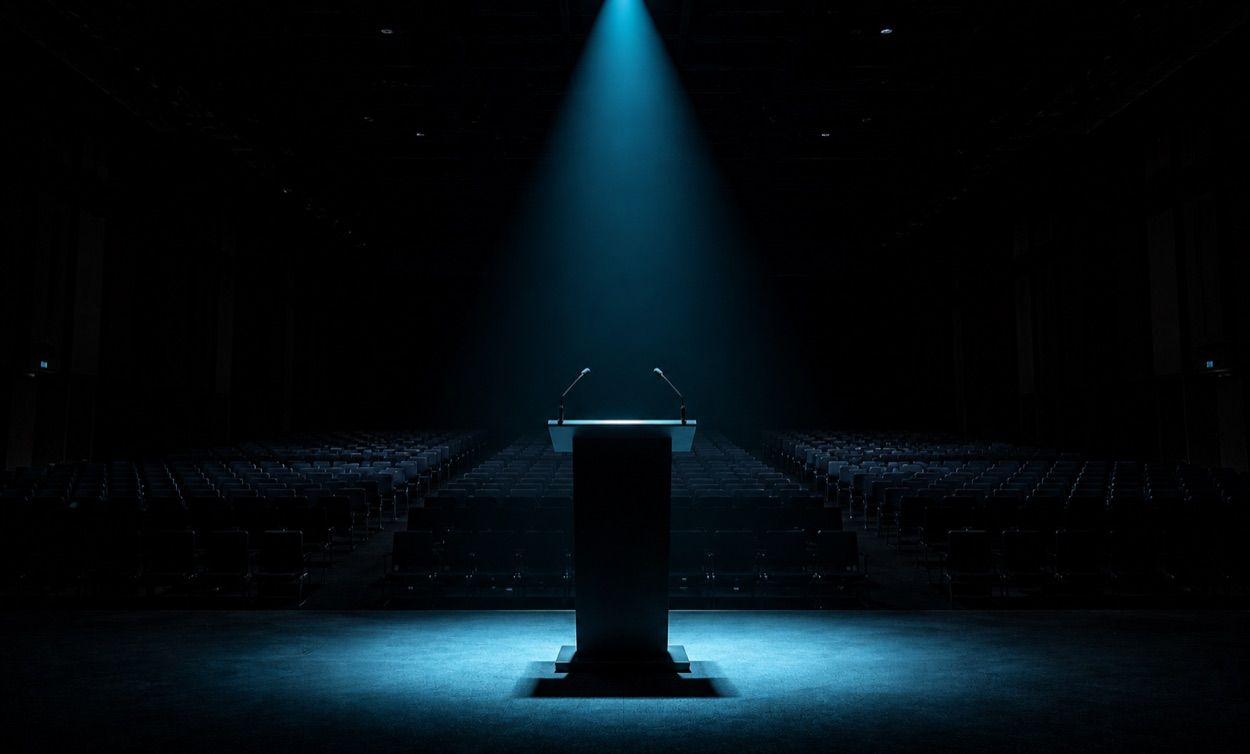 A First Speaking Slot Is a Stronger Signal Than a First Booth